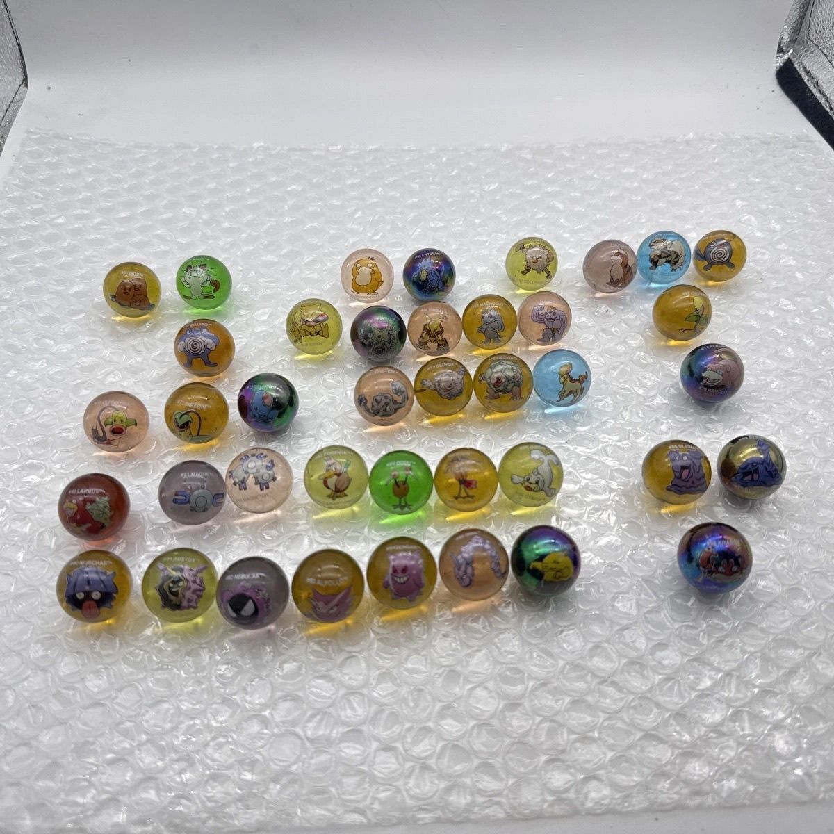 Merchandise oficial Pokémon em - Vintage Collectible Marbles avaliação e preço
